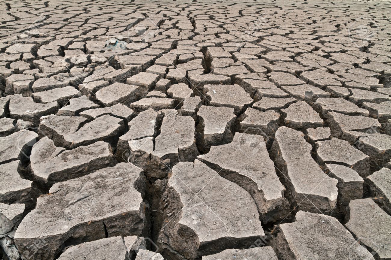 12797847-arid-ground-land-cracked-by-drought-from-global-warming-Stock-Photo.jpg